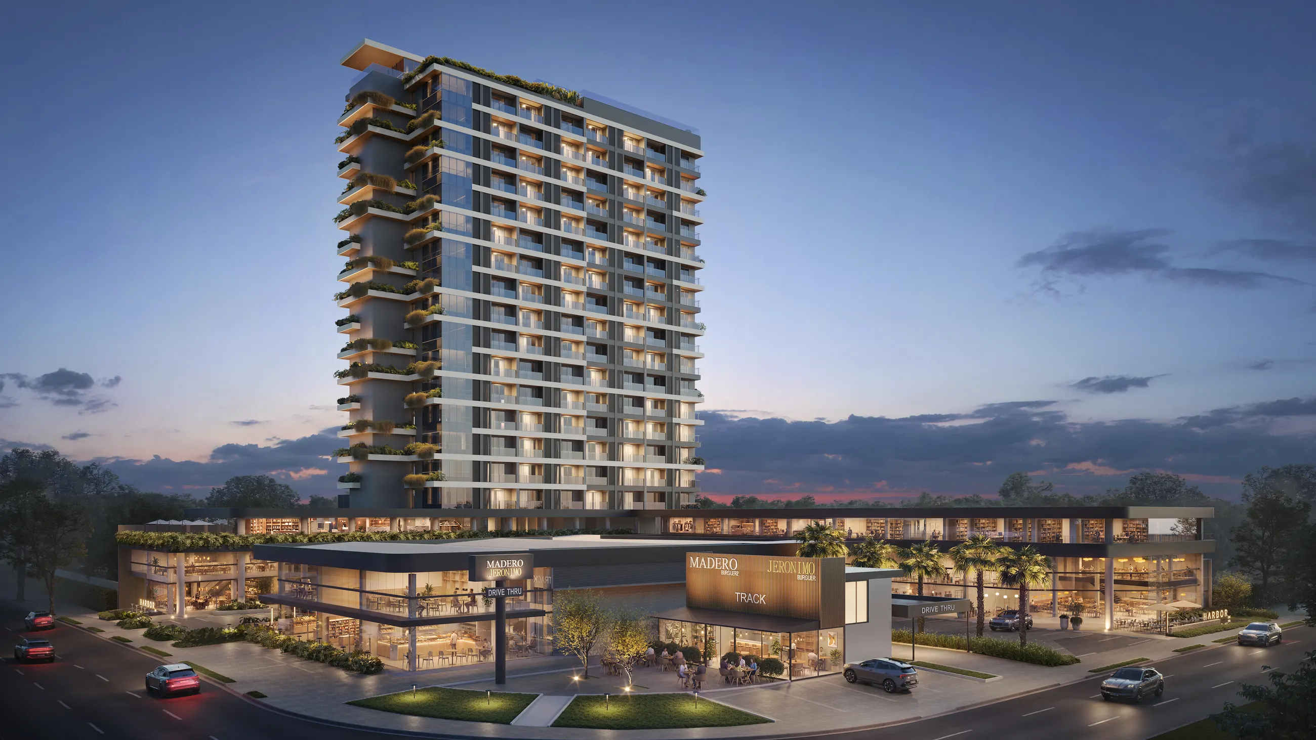 O complexo Harbor 360° à noite: torre de studios sobre o Harbor Mall